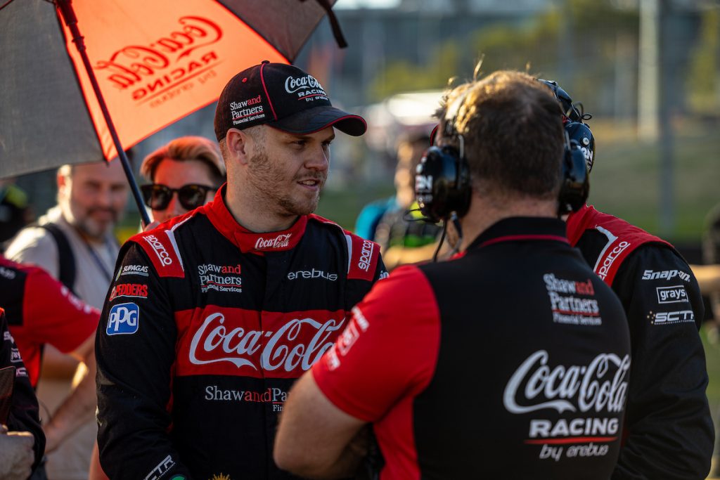 Brodie Kostecki stands on the starting grid before a Supercars race at Sydney Motorsport Park in July 2023