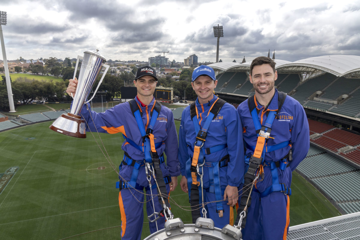 South Australians Tim Slade, Todd Hazelwood, and Scott Pye (left to right) with the Peter Brock Trophy at Adelaide Oval. Image: Supplied