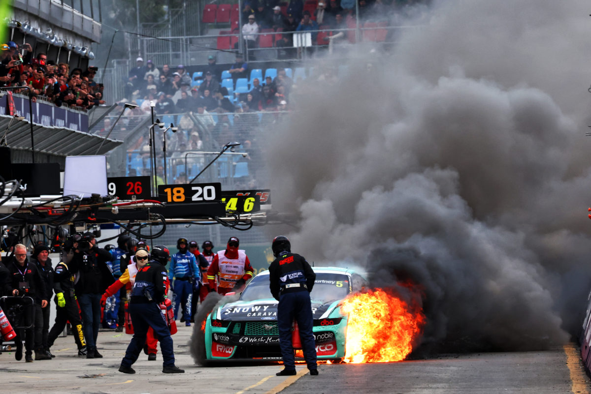 The James Courtney Ford Mustang on fire at Albert Park