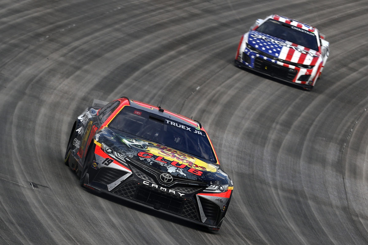 Martin Truex Jr. won a rain-delayed Dover Cup Series race.