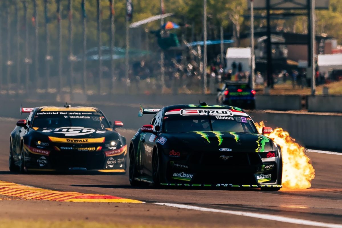 Mark Winterbottom follows the Cameron Waters Ford Mustang as it catches fire at the Darwin Supercars event. Picture: Supplied