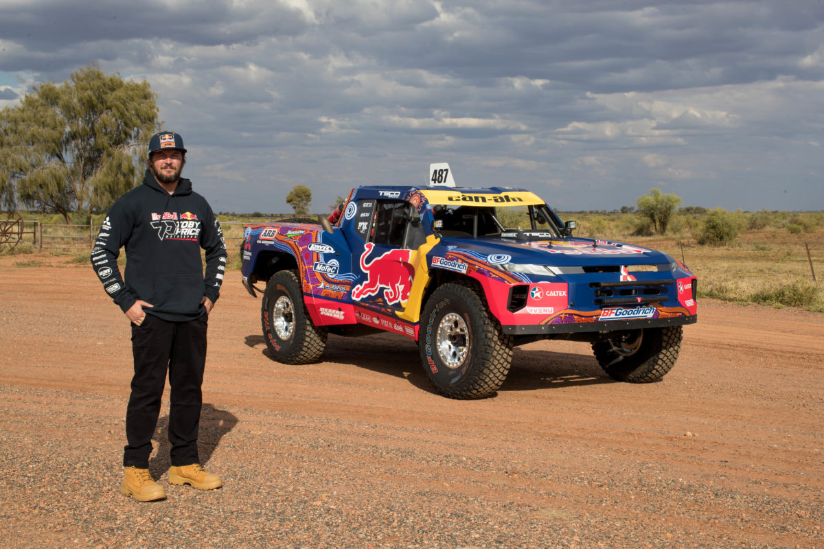 Toby Price with his trophy truck in its Indigenous livery for Finke