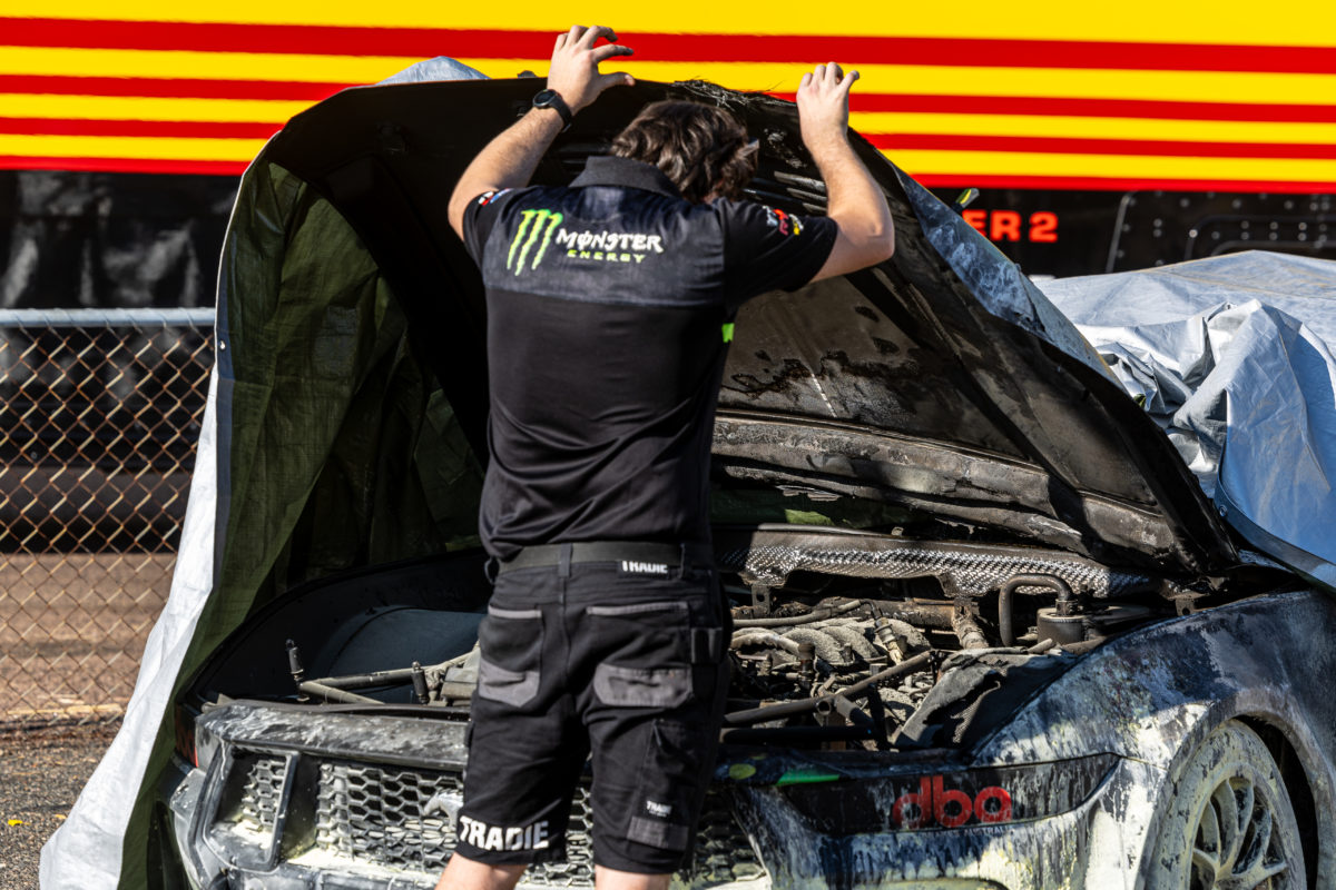 A Tickford Racing crew member examines the Cameron Waters Mustang after its fire. Picture: InSyde Media
