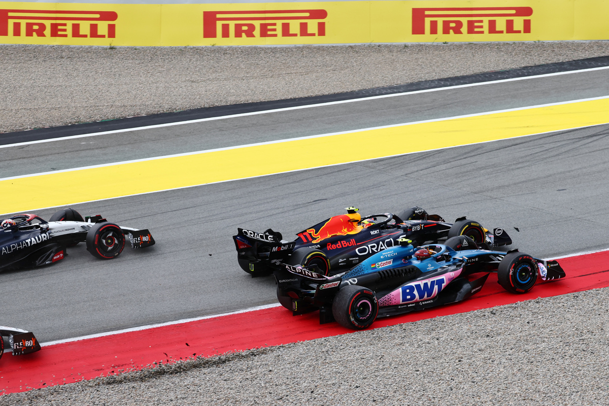 Pierre Gasly goes wheel-to-wheel with Sergio Perez at the start of Sunday's race in Spain