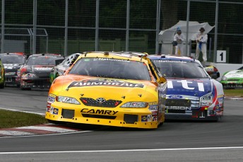 Marcos Ambrose leads Carl Edwards in Montreal last year