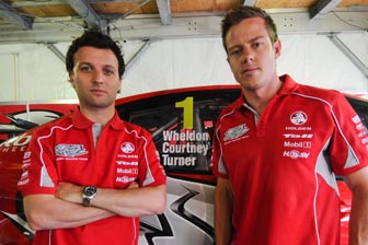 Darren Turner and James Courtney with the window, paying tribute to the late Dan Wheldon