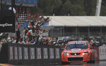Jamie Whincup crosses the line to win the first race of the V8 Supercars Championship