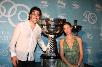 Franchitti, with wife Ashley Judd, receives the 2009 IndyCar Series trophy, fresh from being thrown in a pool by Ryan Briscoe and Tony Kanaan