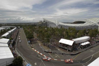 Lee Holdsworth leads Jamie Whincup early in the race