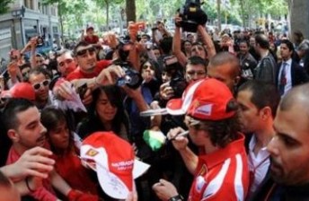 Fernando Alonso signs autographs for the Spanish fans