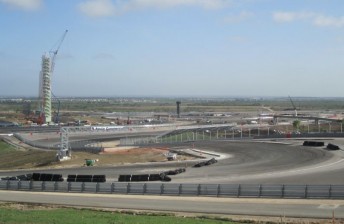 The left-hand hairpin at Turn 1, which rises 400m from the startline, is the highest point on the circuit. The observation tower at Turns 16-18 can be seen in the background.
