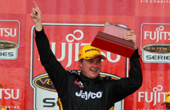 David Russell celebrates his maiden Fujitsu V8 Supercars race win last year at Mount Panorama