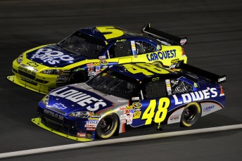 Jimmie Johnson runs side-by-side with team-mate and title rival Mark Martin in Charlotte