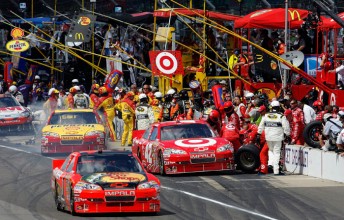 McMurray takes the lead from EGR team-mate Montoya on pit road