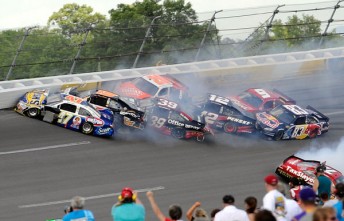 thumb Marcos Ambrose, front of pack, crashes out in Talladega