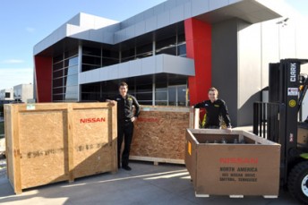 Rick and Todd Kelly unload the Nissan freight delivered to its Braeside, Victoria, workshop