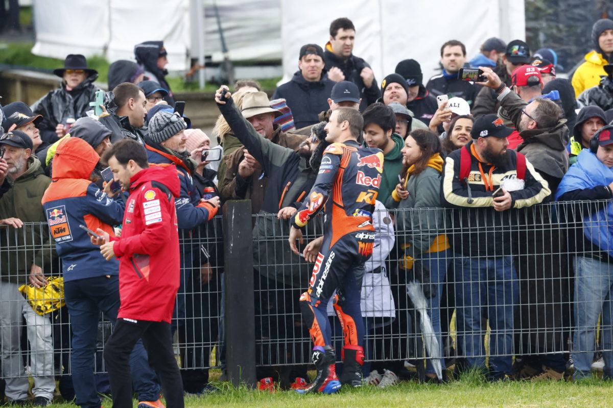 Jack Miller poses for a photograph with a MotoGP fan at Phillip Island after the Sprint was cancelled. Image: Ross Gibb Photography