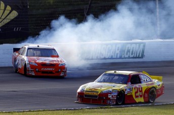 Joey Logano (#20) slids towards the wall after contact with Kevin Harvick (#29)