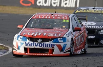 Michael Caruso leads Todd Kelly at Queensland Raceway