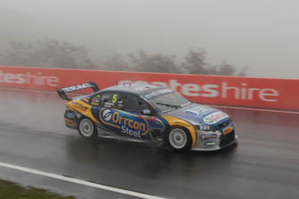 Mark Winterbottom slides through the wet conditions at the top of the mountain