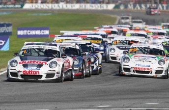 The Carrera Cup field rushes into turn one at Barbagallo Raceway