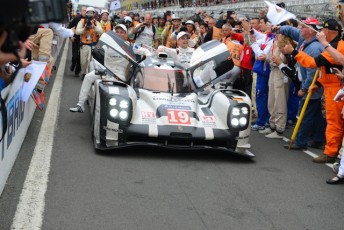 The winning 919 returns to pit lane mobbed by photographers. pic: Ian Musson PSP Images
