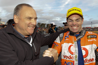TeamVodafone team owner Roland Dane celebrates with Craig Lowndes after winning the last event at Queensland Raceway