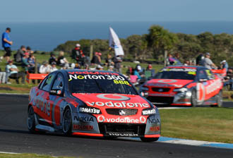 The #888 TeamVodafone Commodore leads the sister #88 entry at Phillip Island