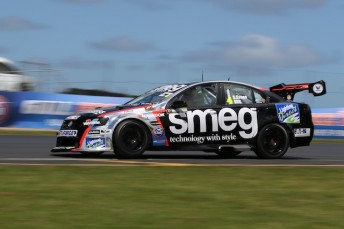 Simon Evans and Shane Van Gisbergen salute in Race 1 at the TR Group Waikato 400 at Hampton Downs. Pics: Neville Bailey