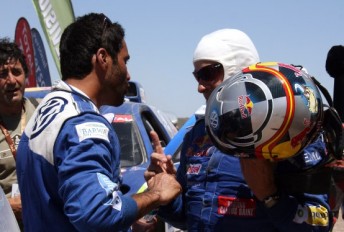 Nasser Al-Attiyah and Carlos Sainz exchange words after the penultimate stage in the Dakar Rally
