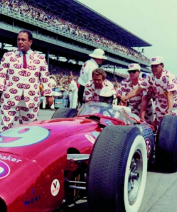 Andy Granatelli dressed in colouful STP-adorned suit at the Indy 500