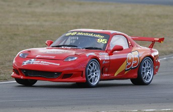 Stephen Anslow in his Lightning McQueen-inspired Mazda RX7