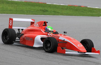 Jordan Love behind the wheel of the FIA South East Asia Formula 4 car