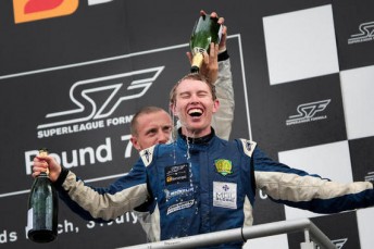 Australian John Martin on the Brands Hatch podium after his victory