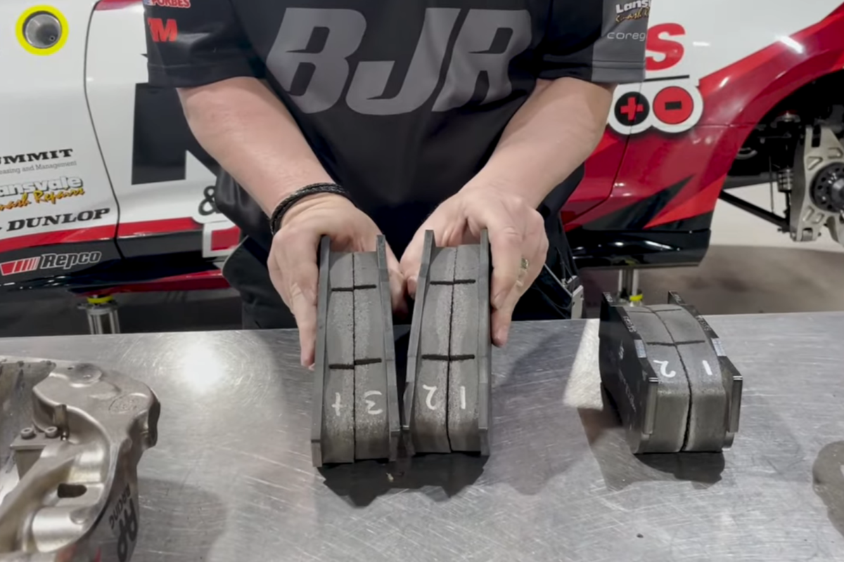 Brad Jones compares a set of brake pads after the Bathurst 1000. Image: Brad Jones Racing