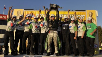 Jack Beckman and his crew celebrate after being crowned NHRA Funny Car Champions