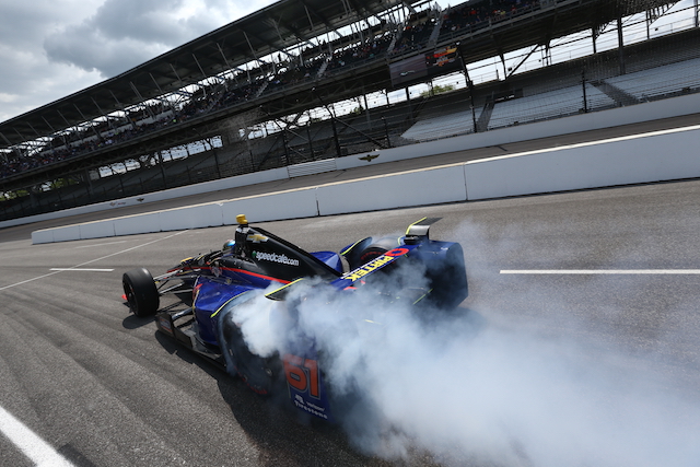 Firing out of his pit box during a practice session