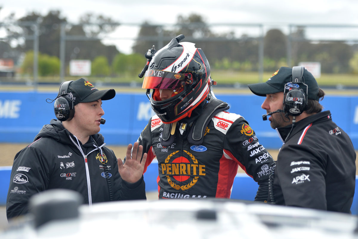 Grove Racing co-driver Kevin Estre (centre) with Car #19 Race Engineer Jack Bell (left) and Technical Director Grant McPherson (right). Image: Russell Colvin