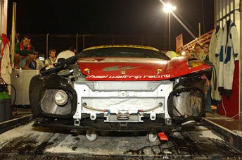 The crashes Ferrari F430 of AF Corse is retired after Michael Waltrip was involved in heavy contact with another car