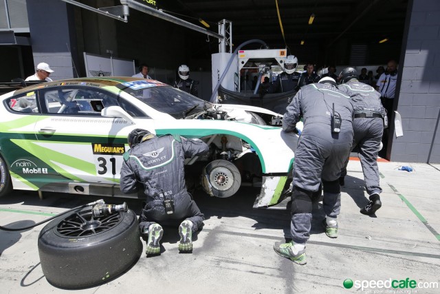 The #31 Bentley being repaired after a mid race accident with the #38 Wall Racing Porsche