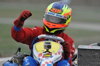 Jake Dennis crossing the line to become the first champion in the new World Under 18 Karting Championship. Pic: KSP