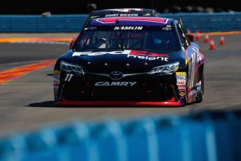 Denny Hamlin withstood a strong challenge to head off rivals and win at Watkins Glen