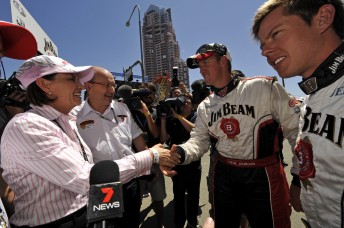 Queensland premier Anna Blight shakes hands with Steven Johnson and James Courtney from Jim Beam Racing today