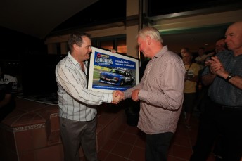 Queensland sports minister Phil Reeves presents Dick Johnson with his Pirtek Australian Legends one-off poster