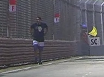 Television cameras caught Yogvitam Pravin Dhokia invading the track during the Singapore GP