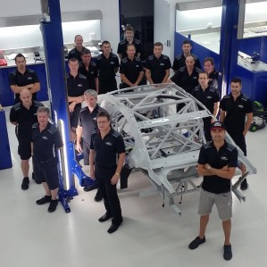 Coulthard with his DJR Team Penske crew members 