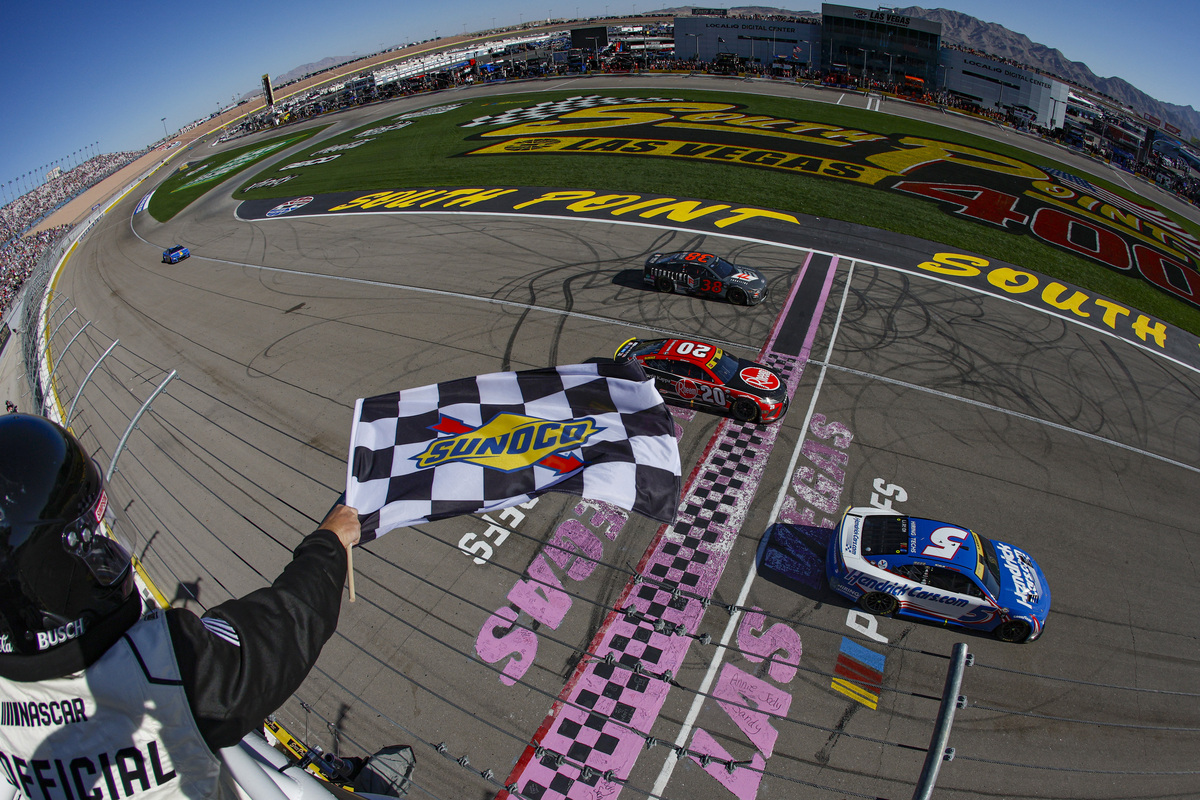 Kyle Larson takes the checkered flag over Christopher Bell to win the NASCAR Cup Series South Point 400 at Las Vegas Motor Speedway. Image: NASCAR Media//Getty Images