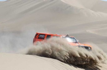 Robby Gordon rolled on Stage 13