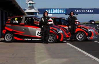 The Gray sisters pose with their Toyotas at Phillip Island