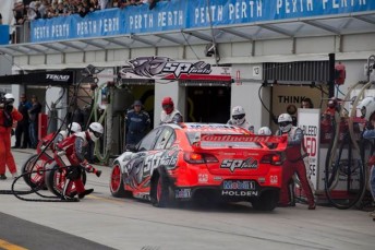 Garth Tander pits for a new left-rear tyre